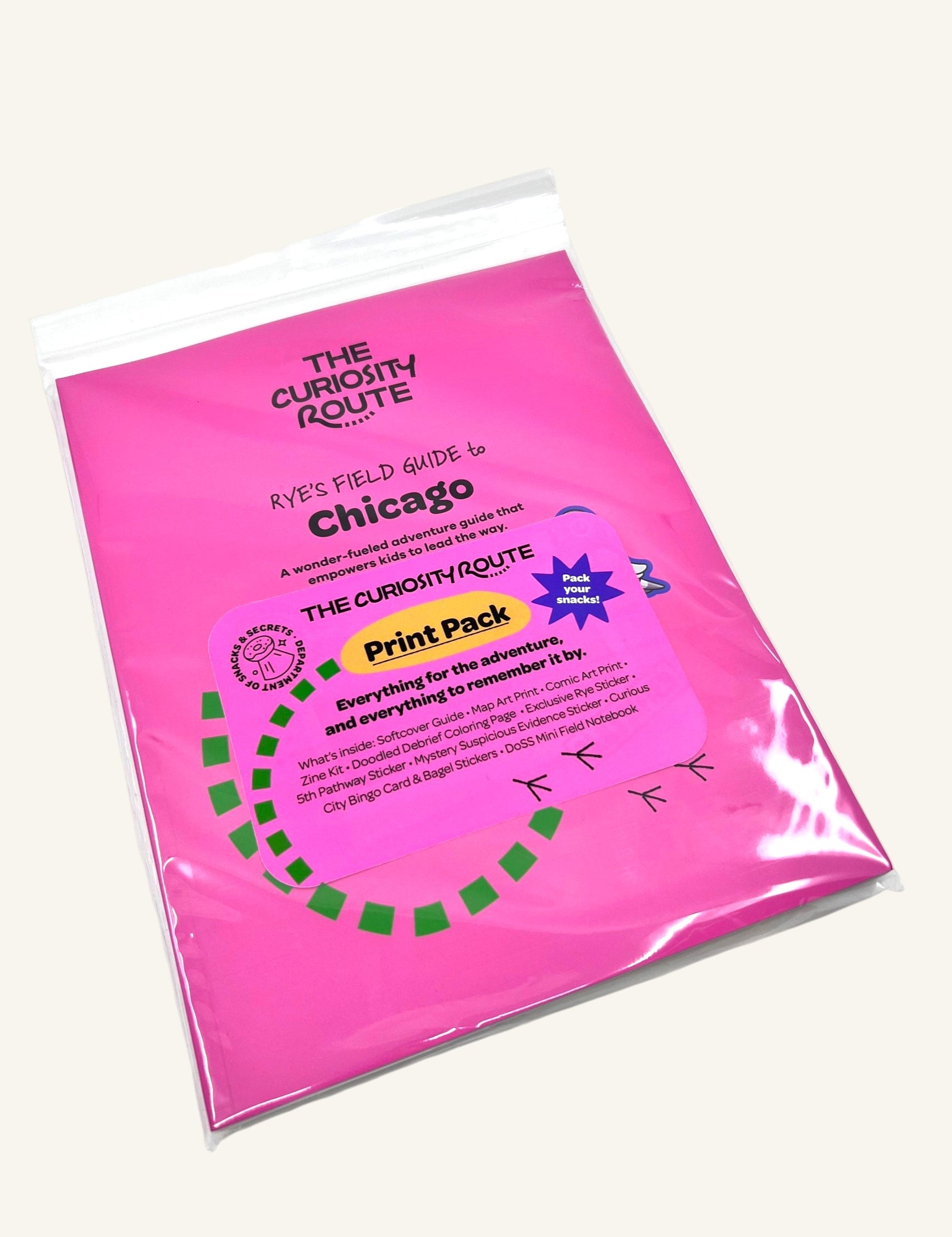 The Curiosity Route Rye's Field Guide to Chicago Print Pack in a bright pink protective sleeve with product details.