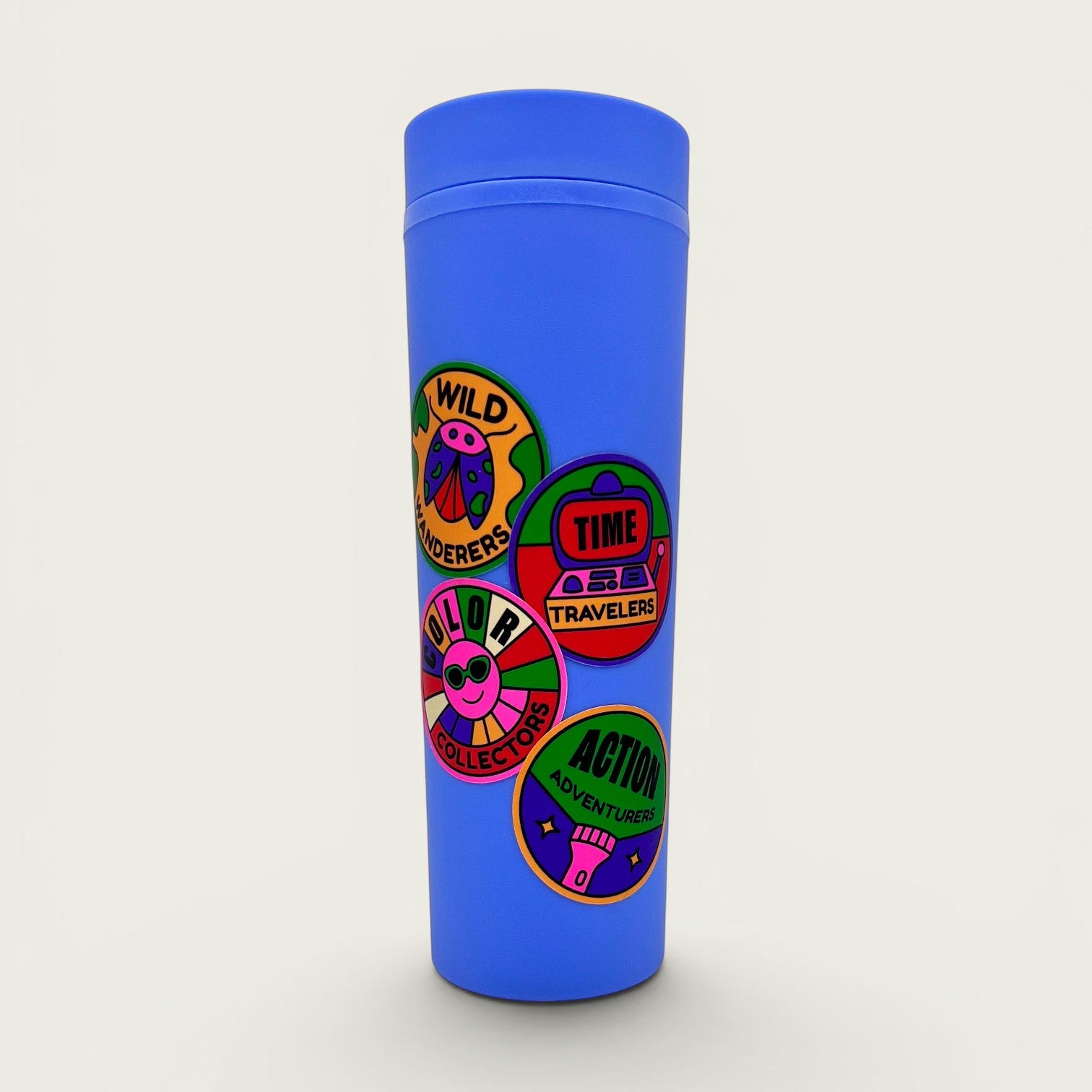 The Curiosity Route waterproof matte vinyl explorer stickers applied to a blue reusable water bottle