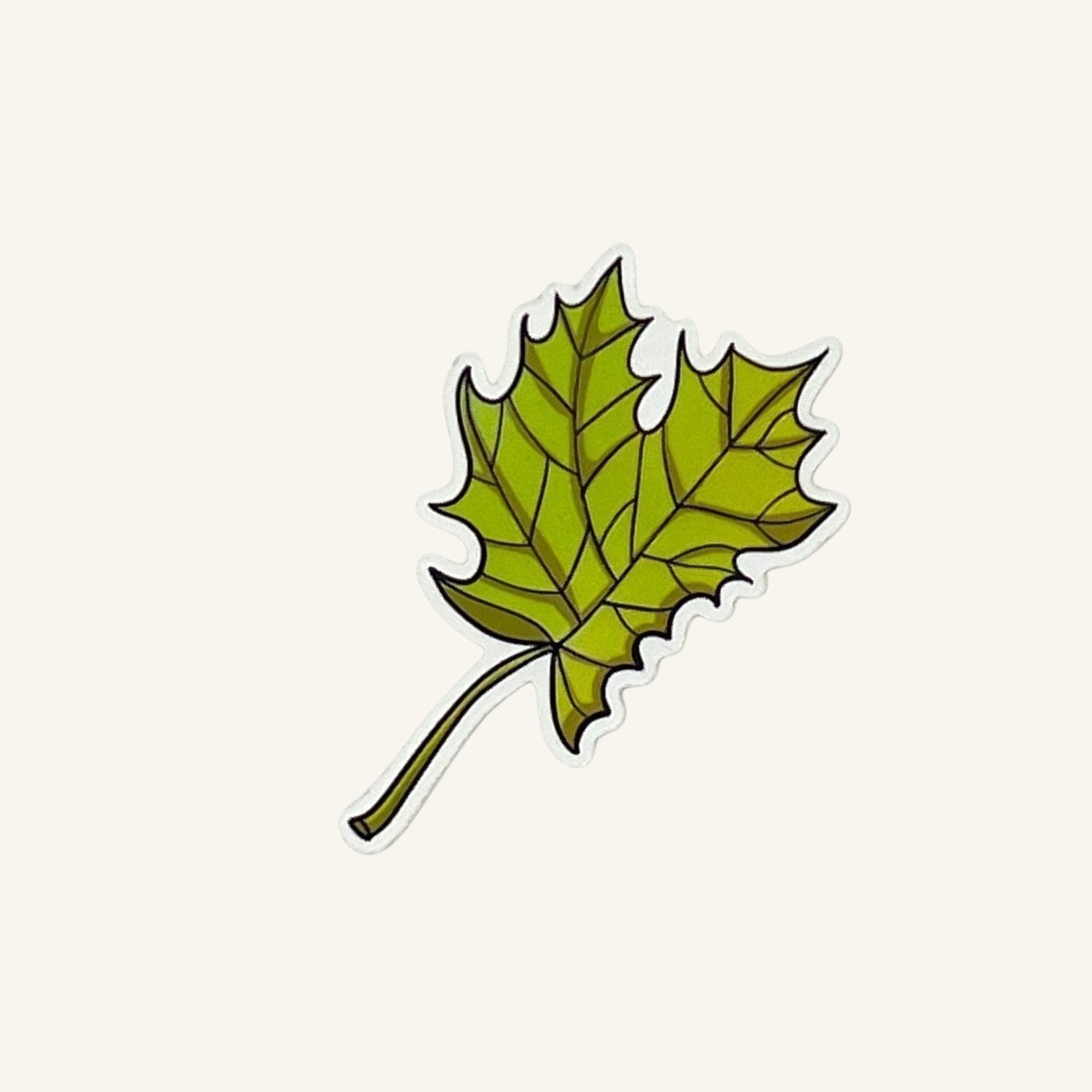 The Curiosity Route matte vinyl sticker featuring a green nibbled maple leaf evidence design.